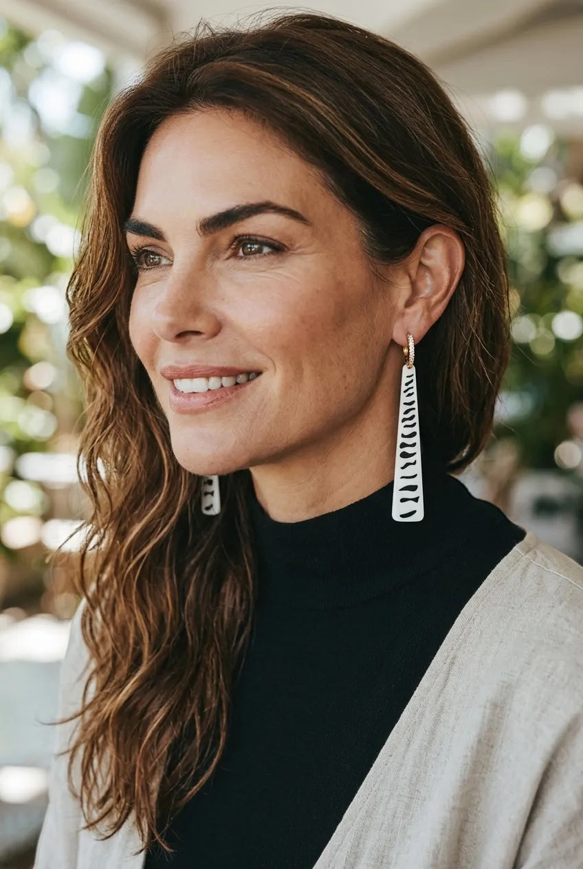 RISITEC - Timeless By Design Zebra Line long drop earrings with black and white patterns and 24K gold-plated hoops.
